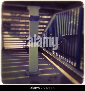 Train station platform railings and stairs Stock Photo