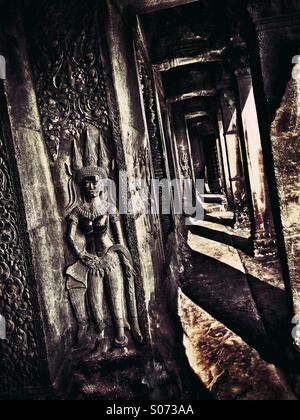 Angkor Wat Cambodia interior wall with narrow corridor Stock Photo