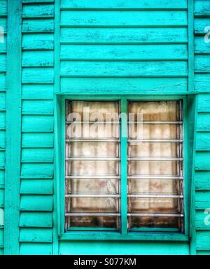 Malaysia old wooden house window at Crab Island fishing village Pulau Ketam Stock Photo