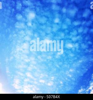 Small clouds at blue sky background