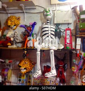 A paper mache skeleton sits on the shells of Taller Tlamaxcalli toy store in Colonia Roma,Mexico City,Mexico Stock Photo
