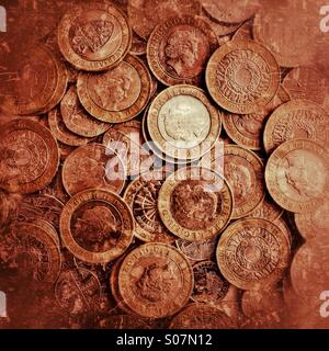 A stash of British £2 coins - cash money GBP currency finance coin money background Stock Photo