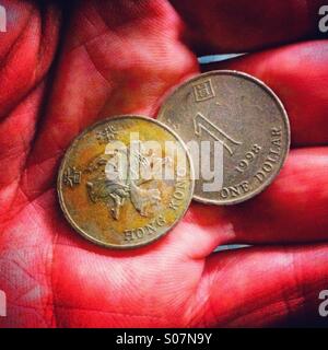 Coins in hand palm Stock Photo