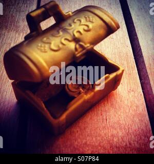 Gold coin in treasure chest Stock Photo