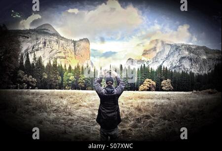 Man taking photo in Yosemite National Park, California Stock Photo