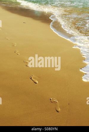 Footprints on the sand Stock Photo