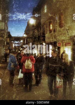 Busy shopping street at night York North Yorkshire England Stock Photo