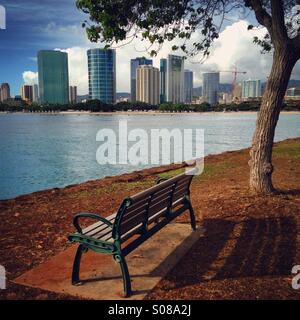 Bench at Magic Island overlooking Ala Moana Beach, Honolulu, Hawaii, USA Stock Photo