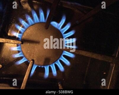 Gas stove. Open flame. No pots or pans. Ready. Cooking time. We have fire. Geometry of shapes. Stock Photo
