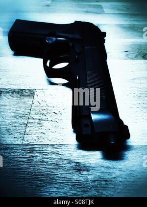 Gun on the floor , crime scene Stock Photo