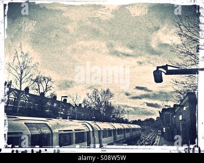 Tube train at Ealing Common underground station, London, UK