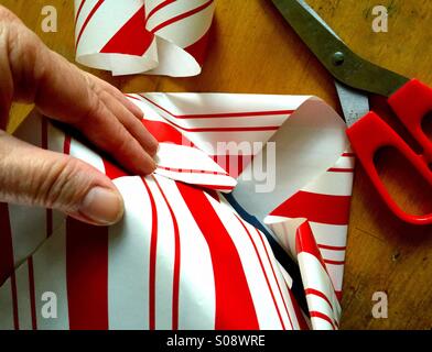 Wrapping Christmas present Stock Photo