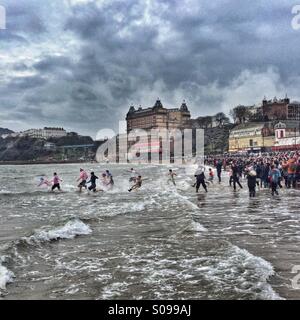 Swimmers brave North Sea for New Year's Day charity swim. Stock Photo