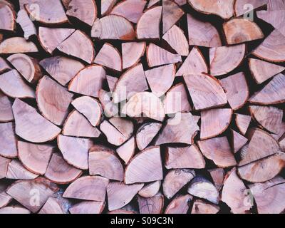 A stack of seasoned hardwood logs. Stock Photo