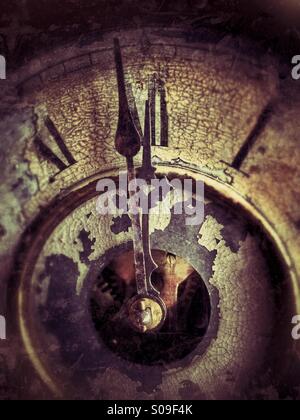 One minute to midnight on an antique clock. Stock Photo