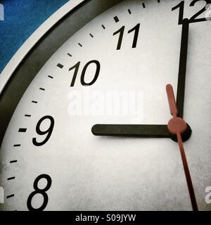 Close up of modern clock face at nine o'clock Stock Photo