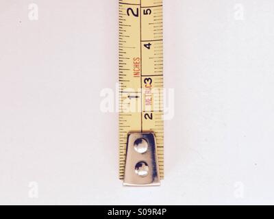 Tape measure in inches & meters Stock Photo