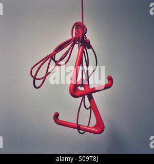 Red emergency pull cord in a disabled toilet Stock Photo