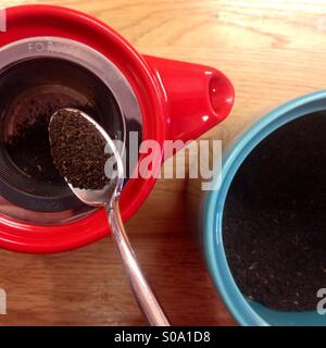 Colourful teapot and jar, making a pot of tea. Stock Photo