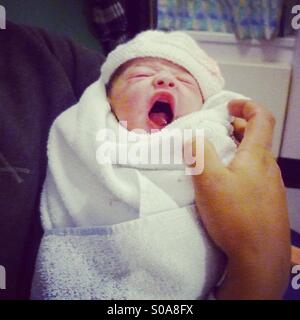 Newborn Baby Yawning Stock Photo