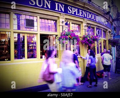 People enjoying summer outside a pub in Holland Park, London Stock Photo