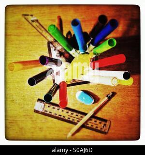 Stationery and colouring in pens in a jar. Stock Photo