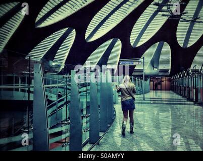 Young woman walking in arrival hall at Moscow international airport Sheremetyevo Stock Photo