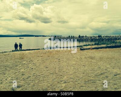 People walking on beach, Powell River, British Columbia, Canada Stock Photo