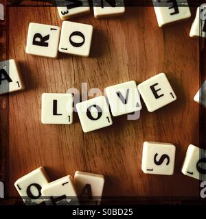 The word LOVE spelled out in gaming tiles Stock Photo