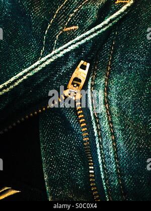 Zipper open on blue jeans Stock Photo