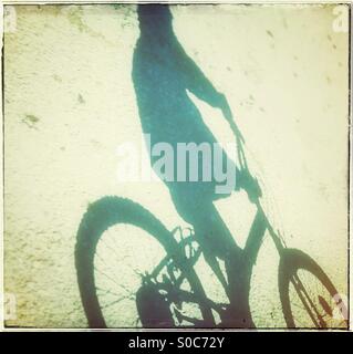 Anonimous person riding a bike Stock Photo