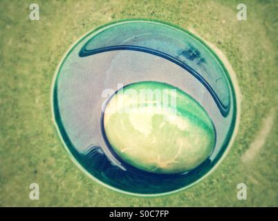 Conceptual colored easter egg. Stock Photo