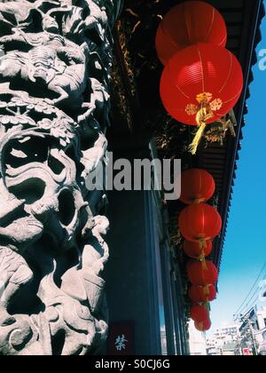 Vibrant red and gold Chinese paper lanterns decorate Chinatown in Yokohama, Japan. Stock Photo