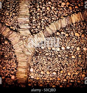 Human skulls and bones decorate yhe Capela dos Ossos ( Bones Chapel ) in Evora, Portugal Stock Photo