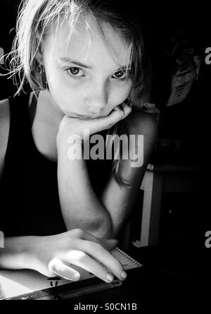 Girl with ipad and notebook Stock Photo