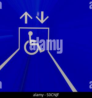 Up down. A stylish wheelchair access sign near an elevator, Ontario, Canada. Pictogram. No words. Only icon. Universal. Stock Photo