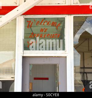We appreciate you sign is still painted on a window in an abandoned gas station on Route 66 in Texas. Stock Photo