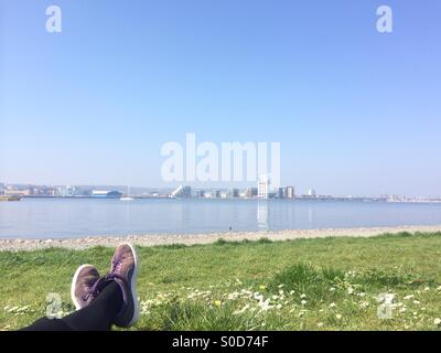 Feet in shot of a photo taken on Cardiff Bay barrage, Wales. Stock Photo