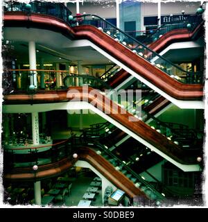 Pattern of escalators at the upscale Princes Square shopping centre Glasgow Scotland