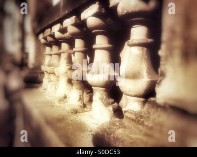 Row of Carved stone pillars Stock Photo