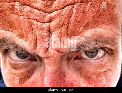 Close up of Middle aged man frowning Stock Photo