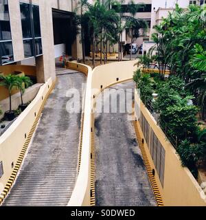 High angle view of parking garage exit in Makati City business district, Manila, Philippines Stock Photo