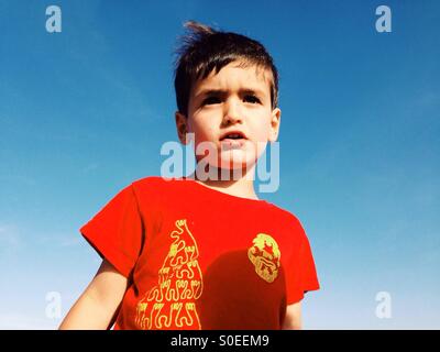 Three years old boy in a red t-shirt Stock Photo