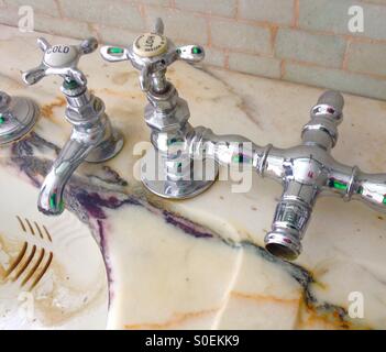 Old bathroom taps. Stock Photo