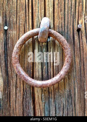 Iron ring attached to old barn boards Stock Photo