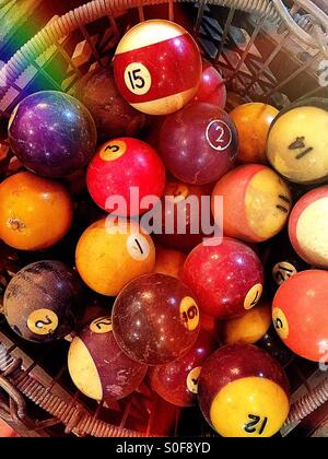 Basket of vintage billiard balls in antique store Stock Photo