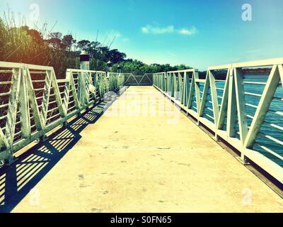 Long pier by the lake. Stock Photo