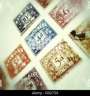 Old postage due stamps in a stamp album. Stock Photo