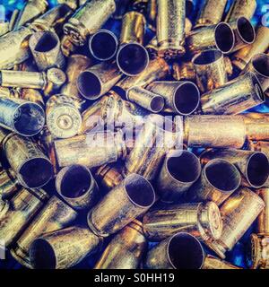 Brass bullet shells in a pile Stock Photo