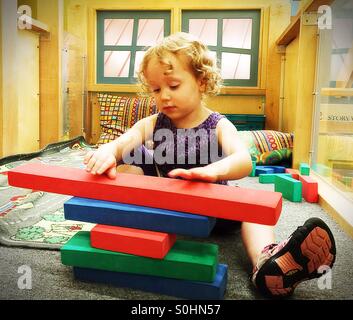 Preschooler building with blocks Stock Photo